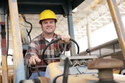 Photo of man working on a fork lift